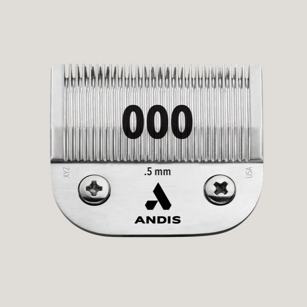 Close-up of the Andis UltraEdge® Detachable Blade, Size 000, showcasing its carbonized steel construction and chrome finish designed for precise, ultra-close hair cutting.