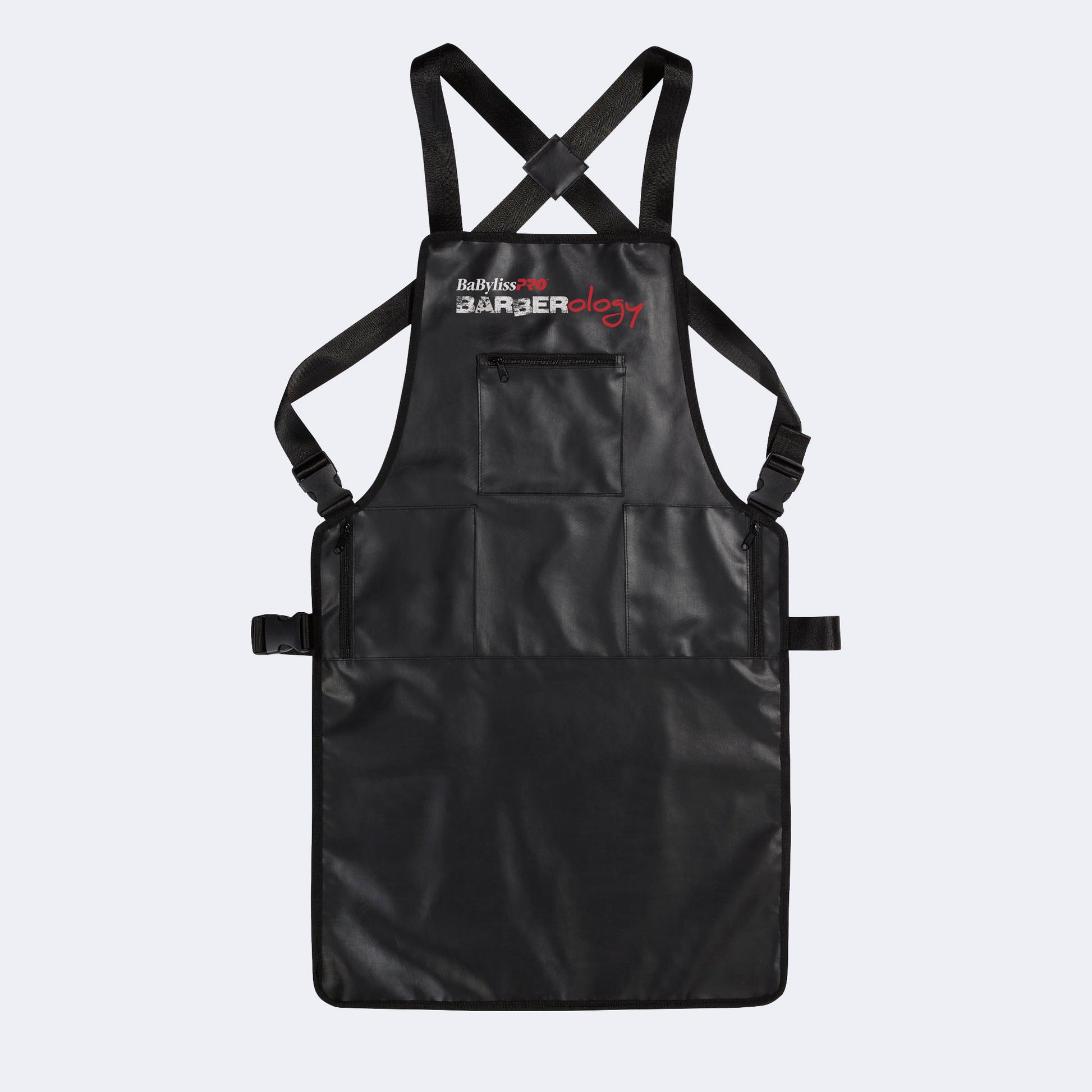 Black apron with crossback straps on a light gray background
