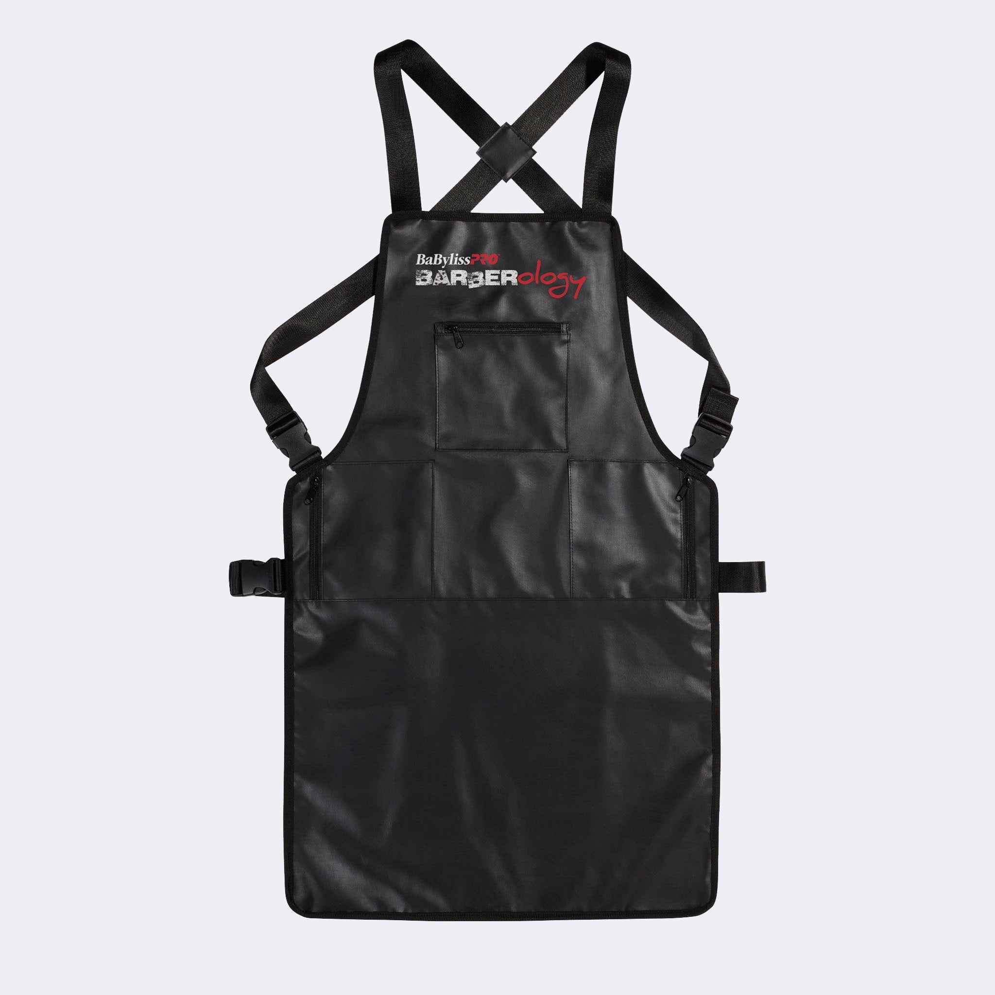 Black apron with crossback straps on a light gray background