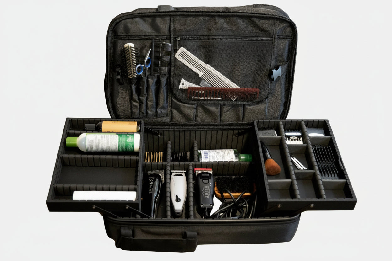 Open black grooming case with various tools on a white background